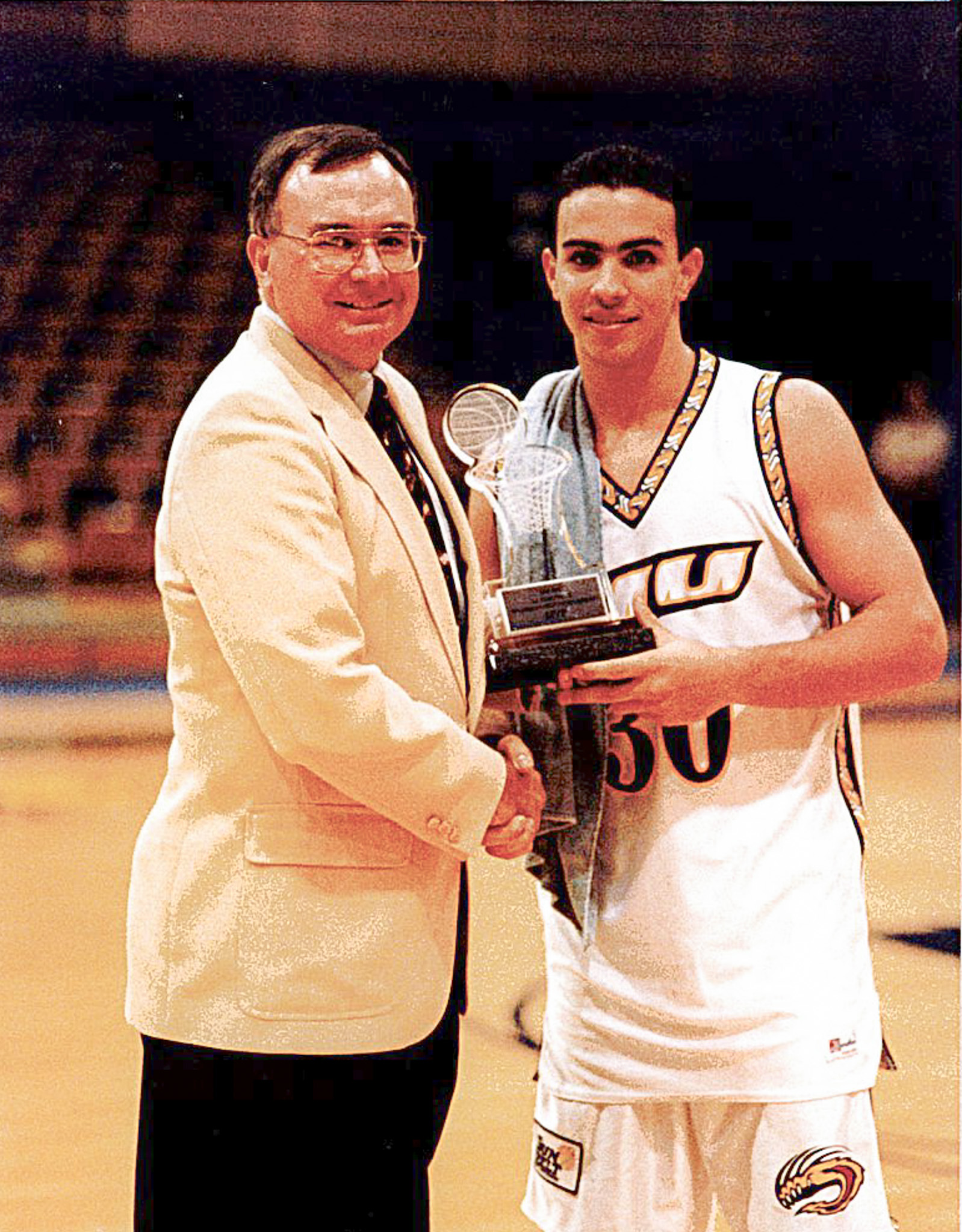Carlos Arroyo earning an award during his time at FIU