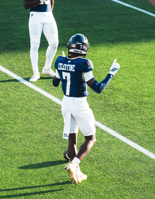 Football player pointing up