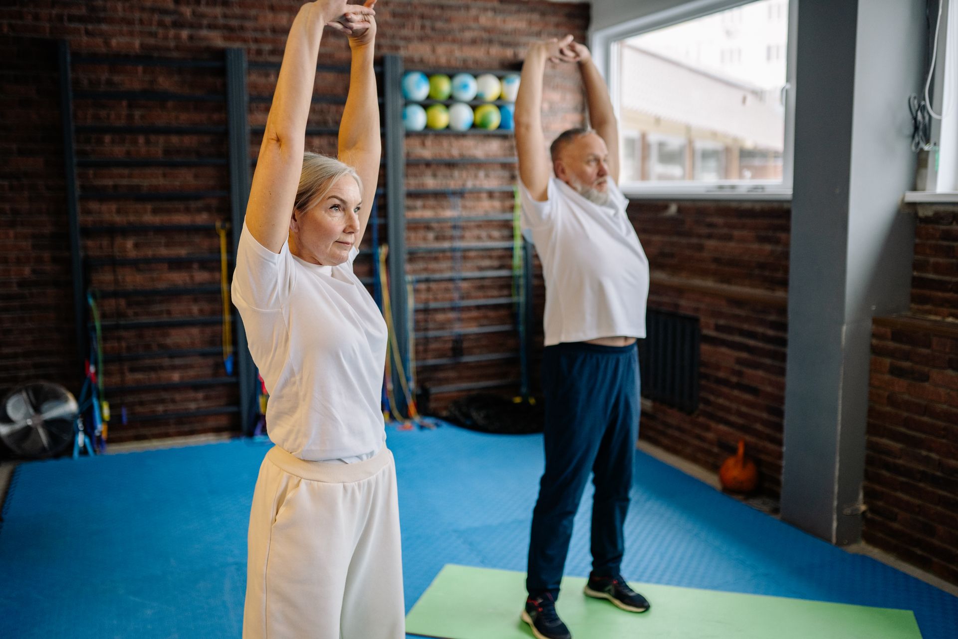 Older couple stretching