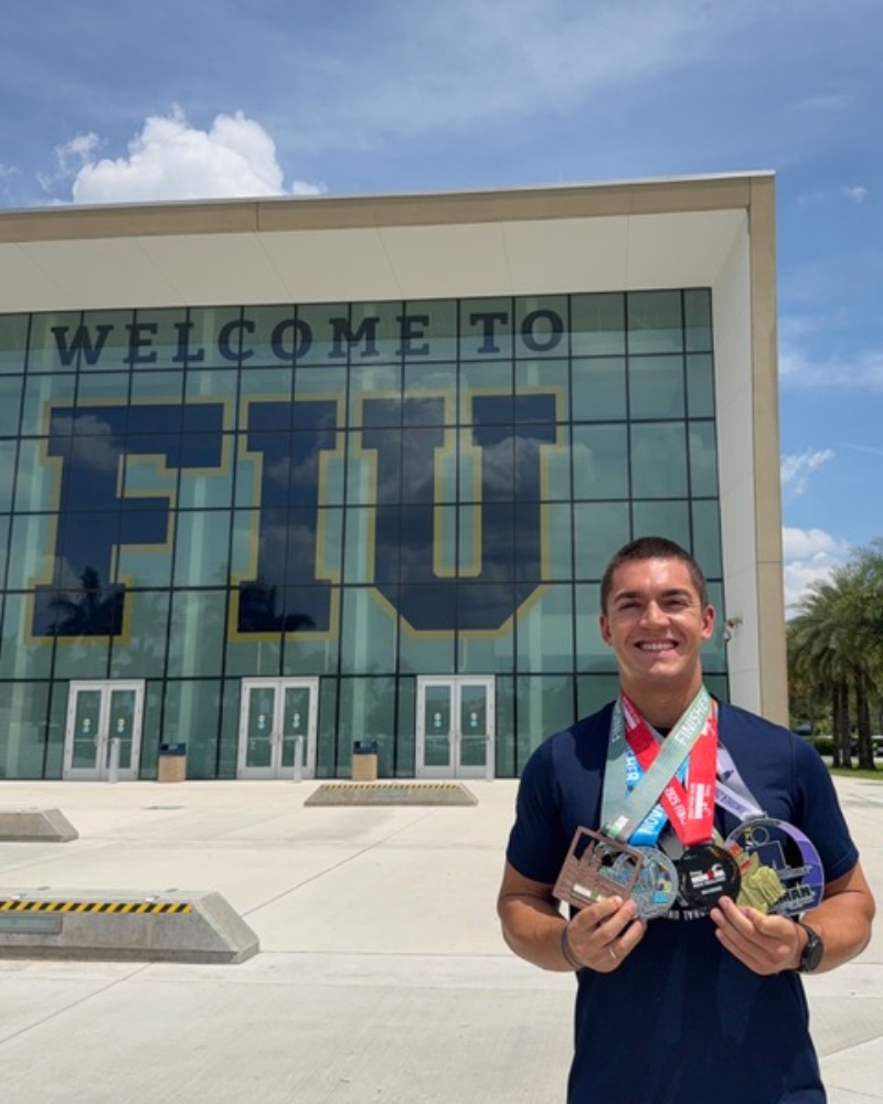 Garotti with his Ironman medals at FIU.