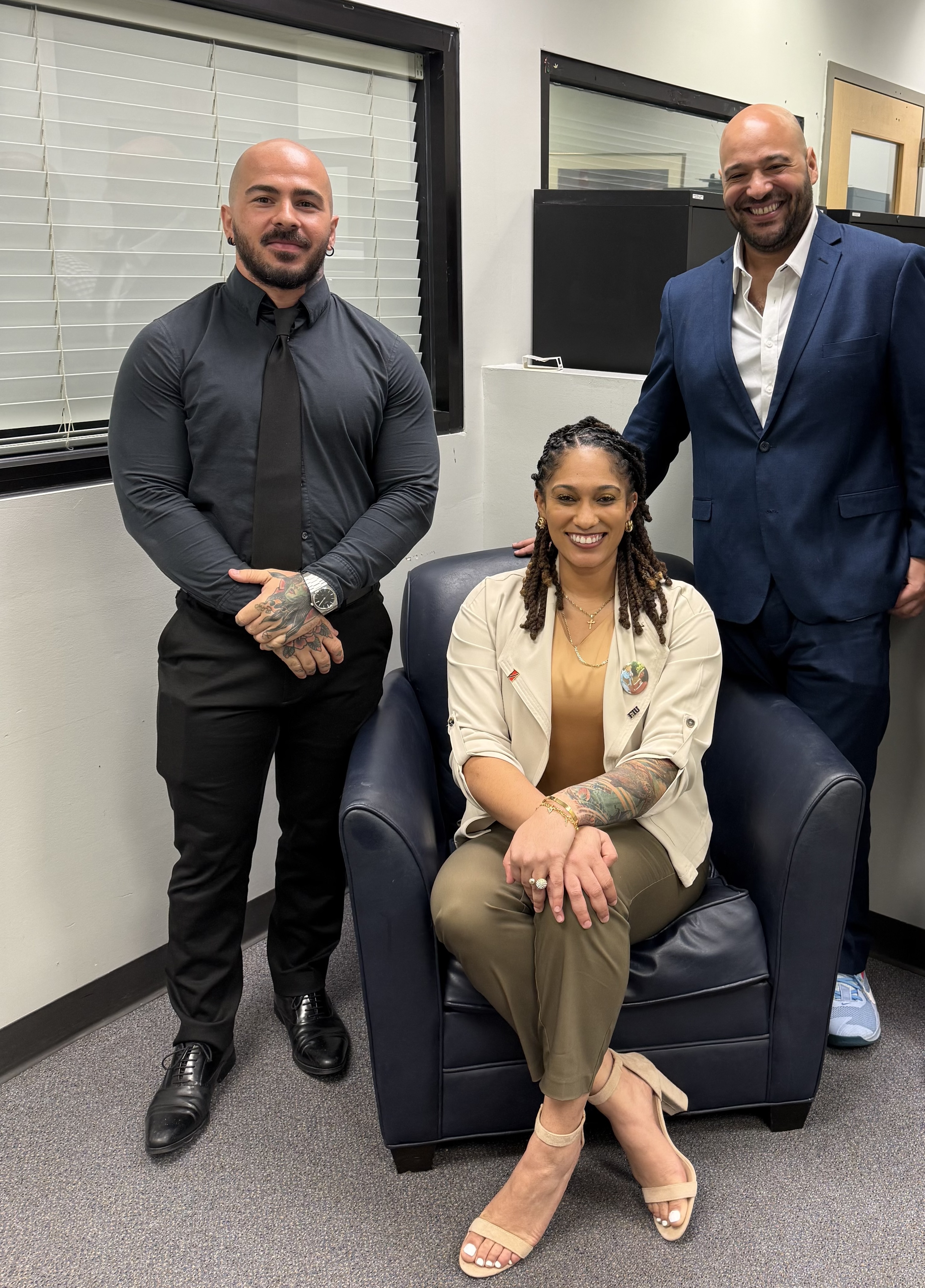 Asia Joseph with professors Marcelo Bigliassi and Trey Watson.