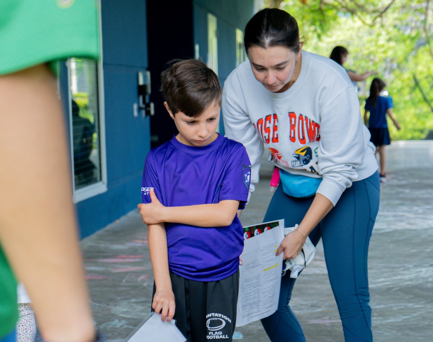 Brave Bunch counselor Rachael Rich encouraging Lucas to participate in the activity