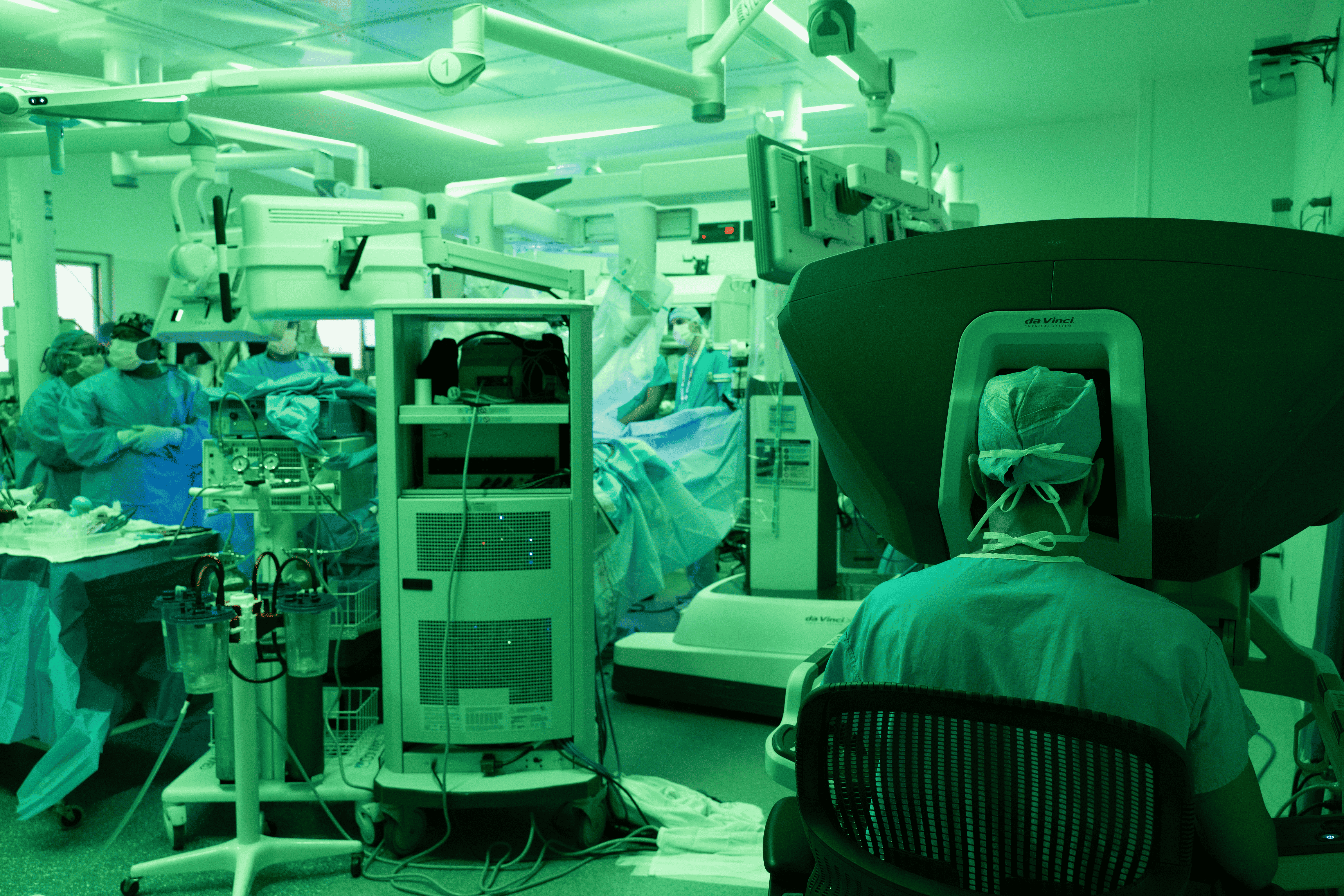Dr. Makoto Hashimoto operates from the surgical console during the robotic-assisted procedure.