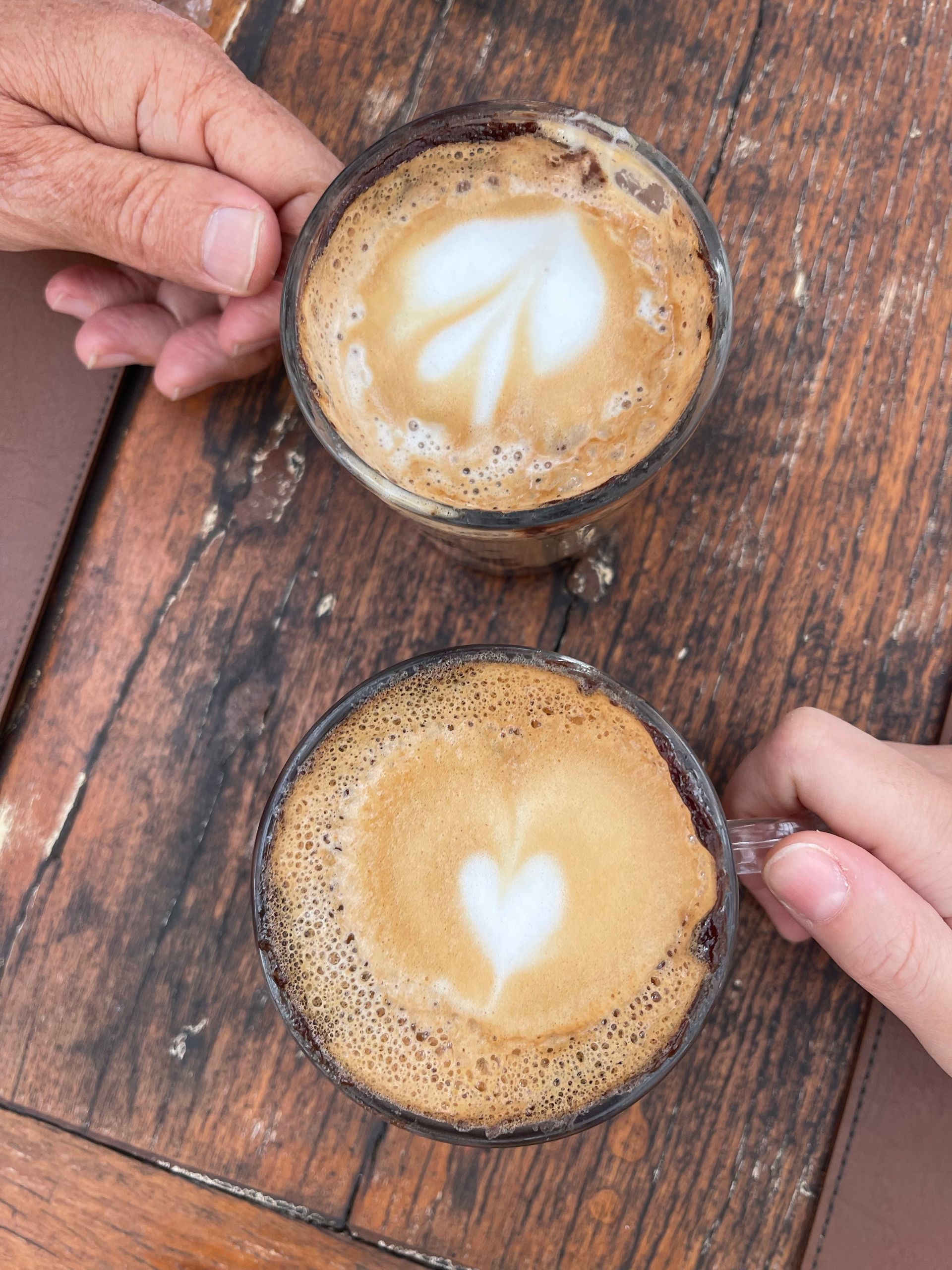 People holding coffee mugs