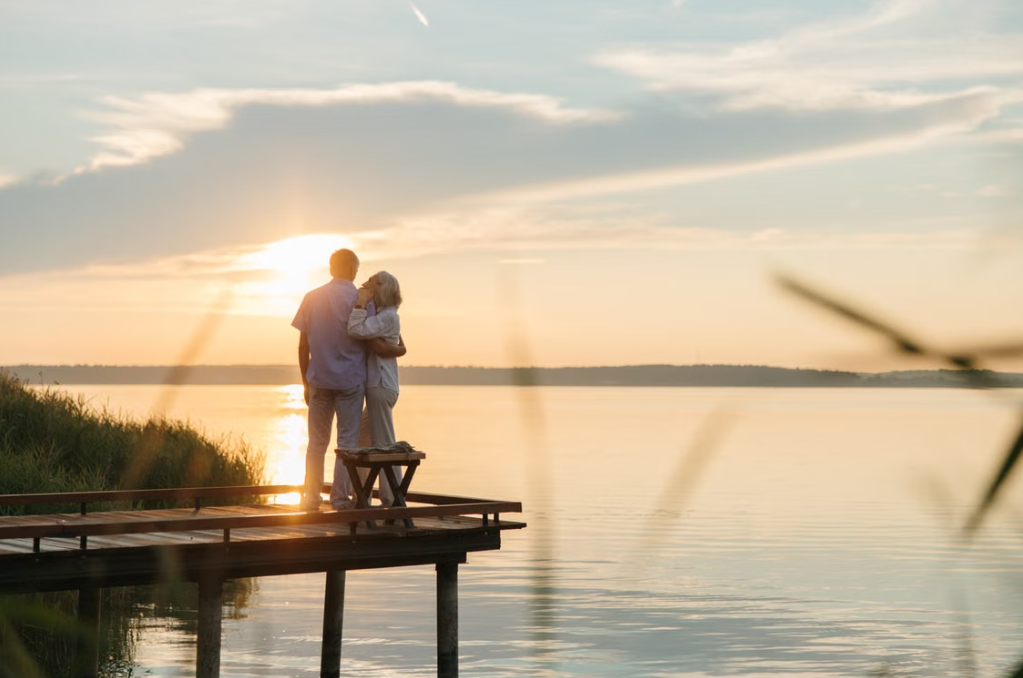 Older couple enjoying a sunrise together