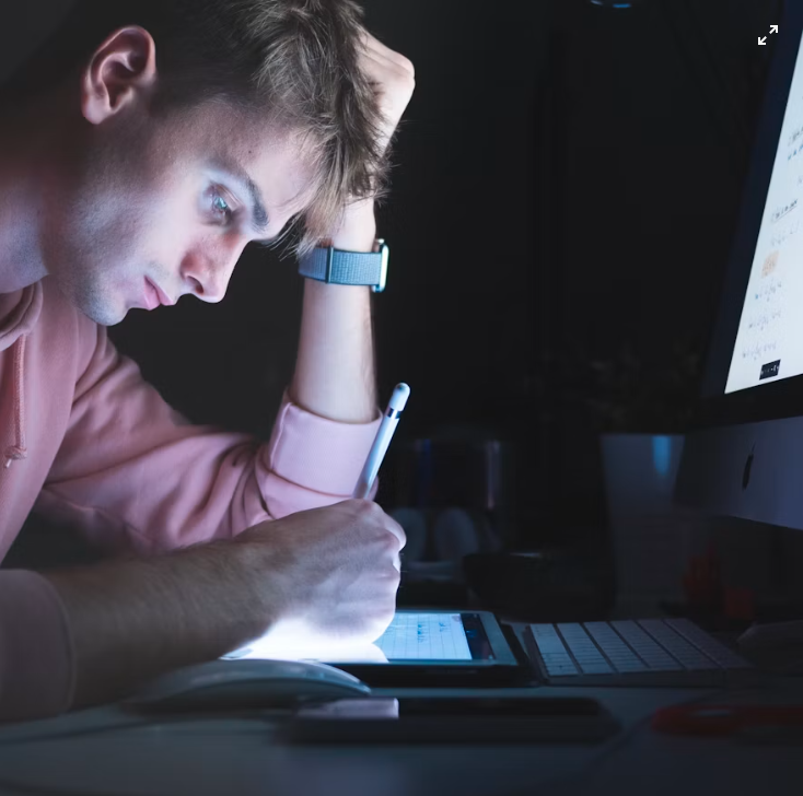 Man studying late into the night