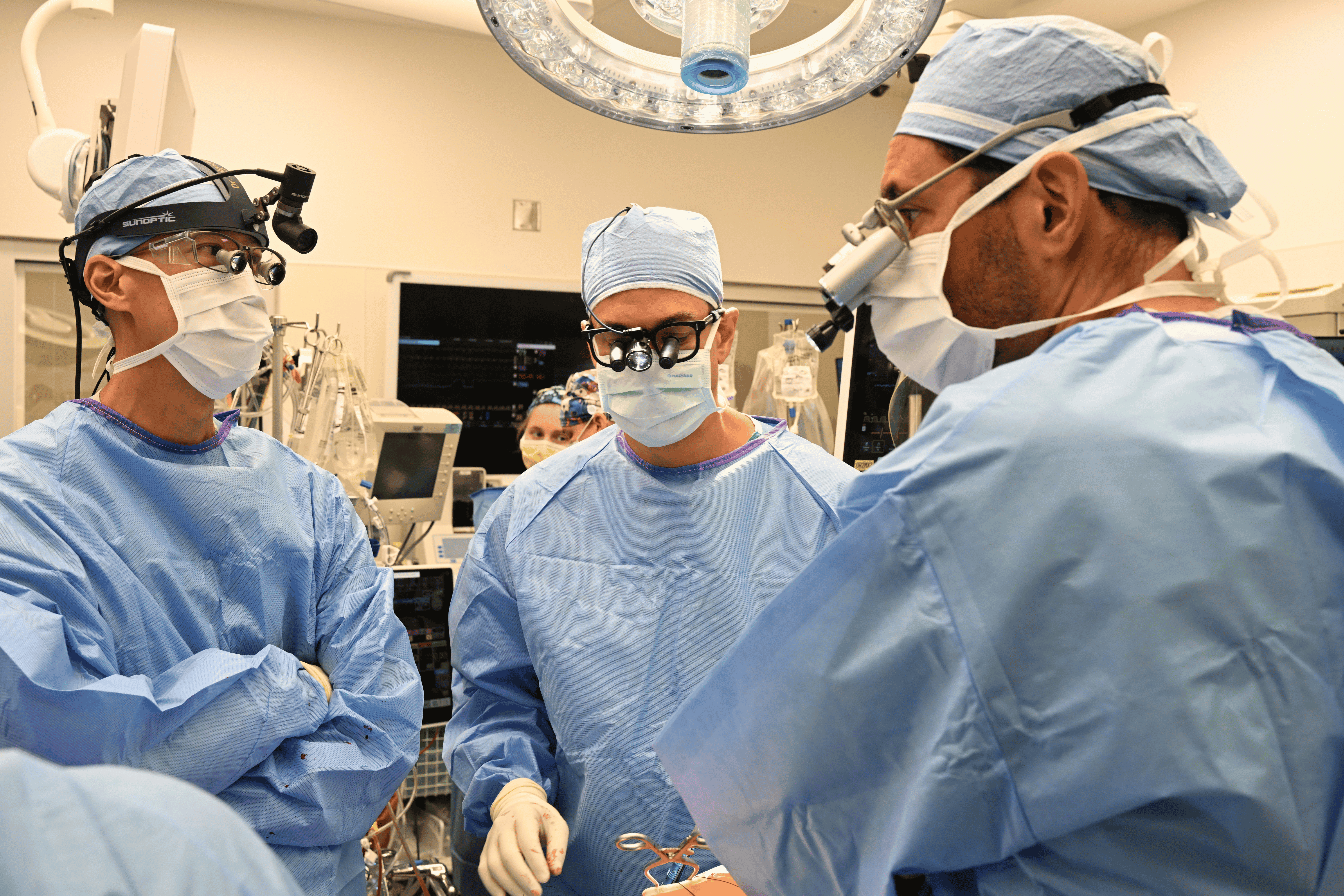 From left: Dr. Tom C. Nguyen, Dr. Makoto Hashimoto and Dr. David Kalfa in the operating room.