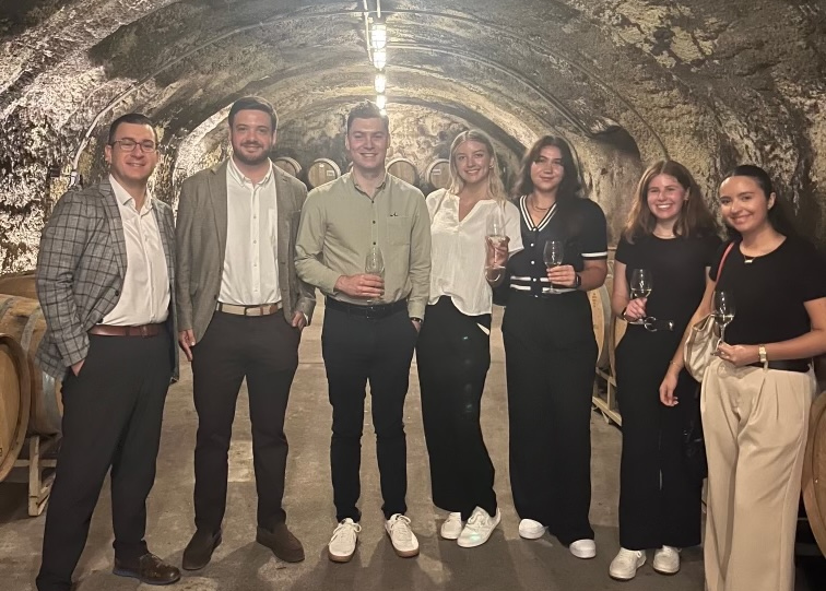 A Pennfolds event in a wine cave; FIU student Elaine Mena is at far right.